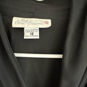 It’s very nice black polyester light blazer type shirt